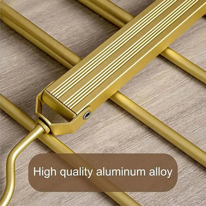 close-up of gold aluminum alloy ladder step with textured surface on wooden background