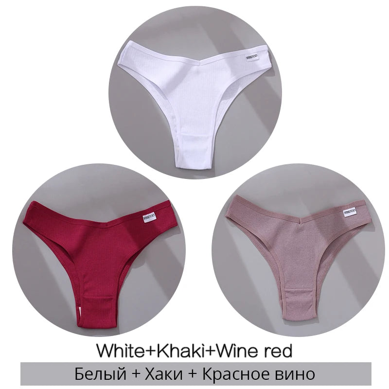 Three ribbed thong panties in white, khaki, and wine red, each with a small label on the waistband