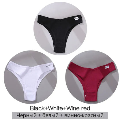 Set of ribbed thong underwear in black, white, and wine red colors with brand tags